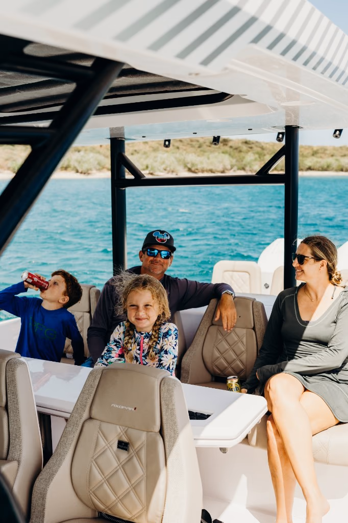 Family relaxing under the suntop aboard Her Deal in the Virgin Islands