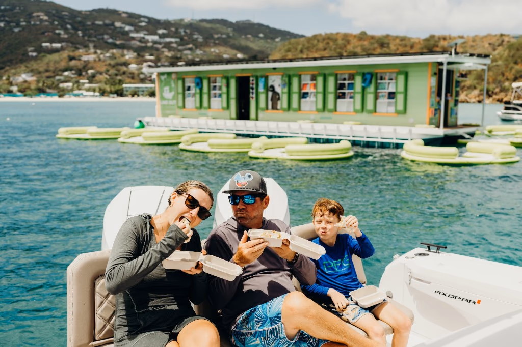 Family enjoying tacos aboard Her Deal at Lime Out, the floating taco bar in St. Thomas