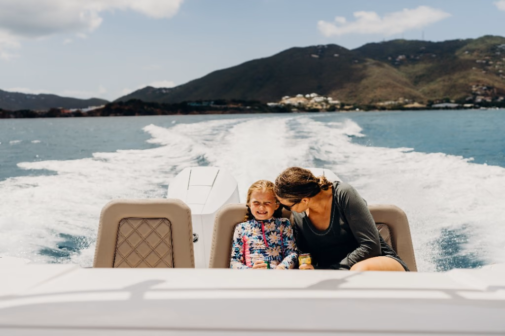 Mother and daughter enjoying the ride at the stern of Her Deal